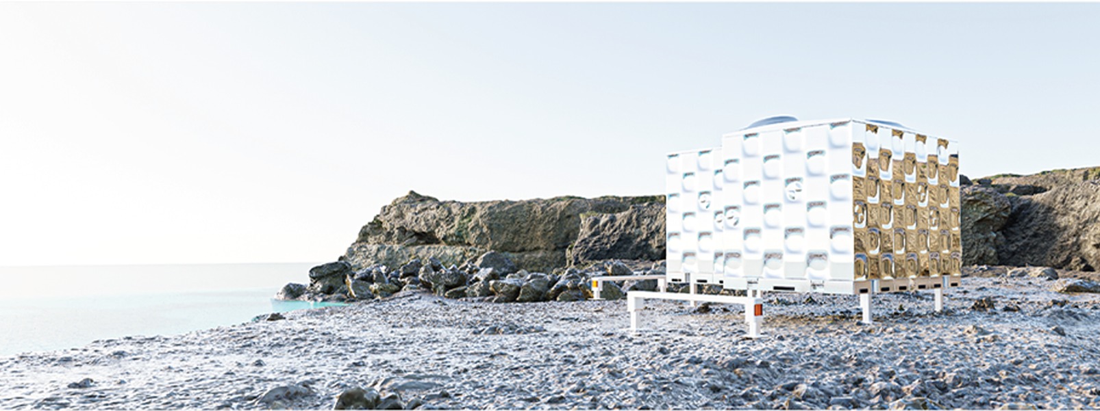 BMW mobility concept pod on a rocky shoreline, mirrored and woven-lattice panels