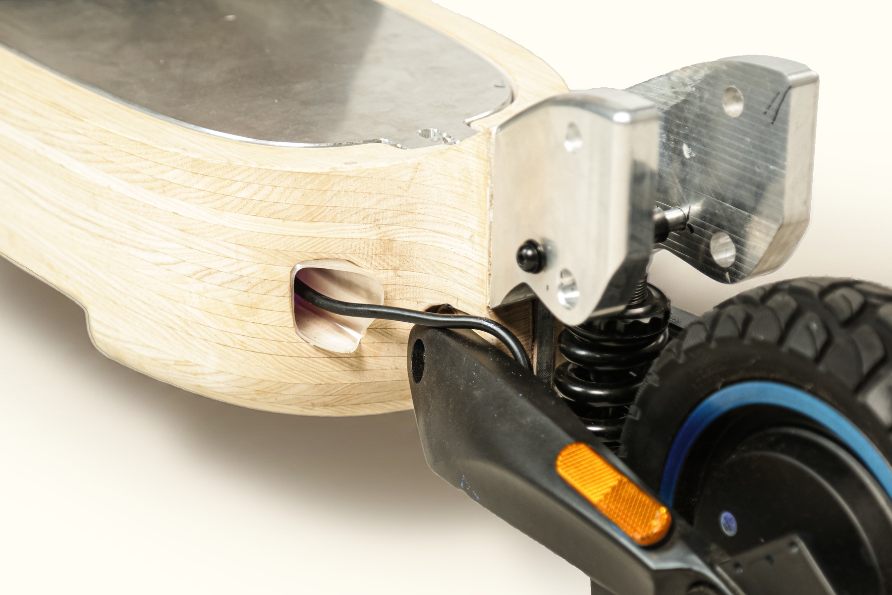 Deck corner detail showing the rear axle bracket and wheel mount