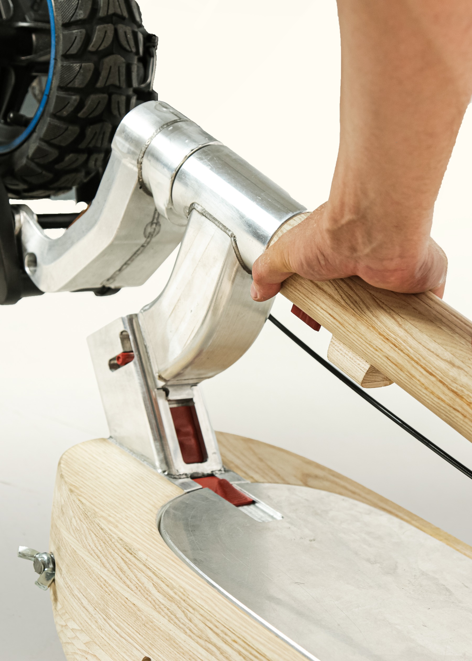Hand pressing the neck down further into the fold position