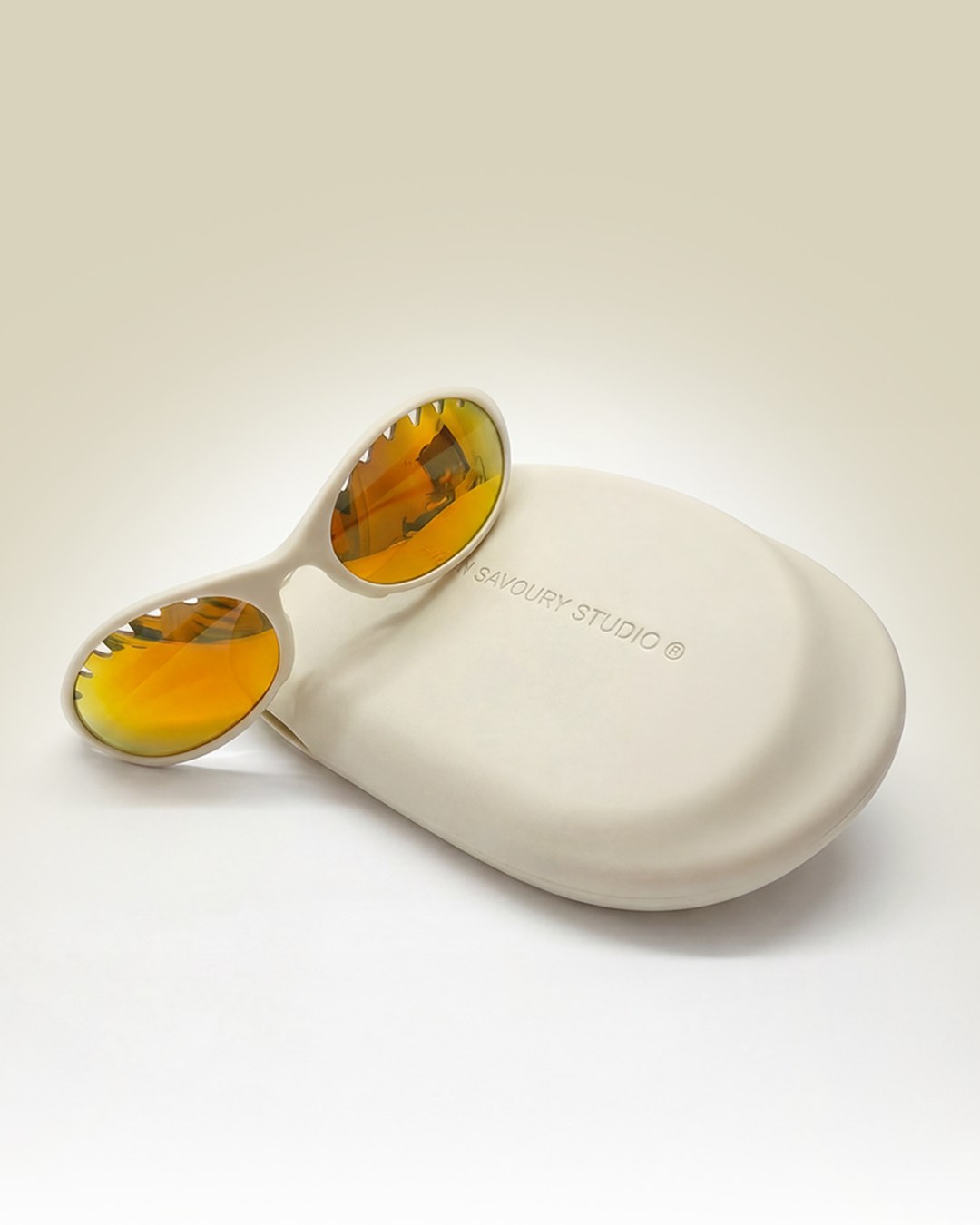 Frame and case in a white colourway with amber mirrored lenses