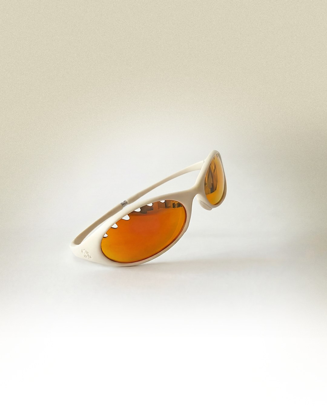 Side profile of the white frame with amber mirrored lenses